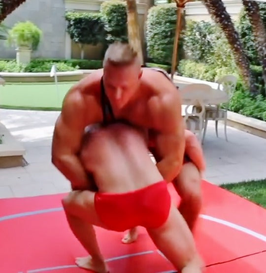 muscular men wrestling